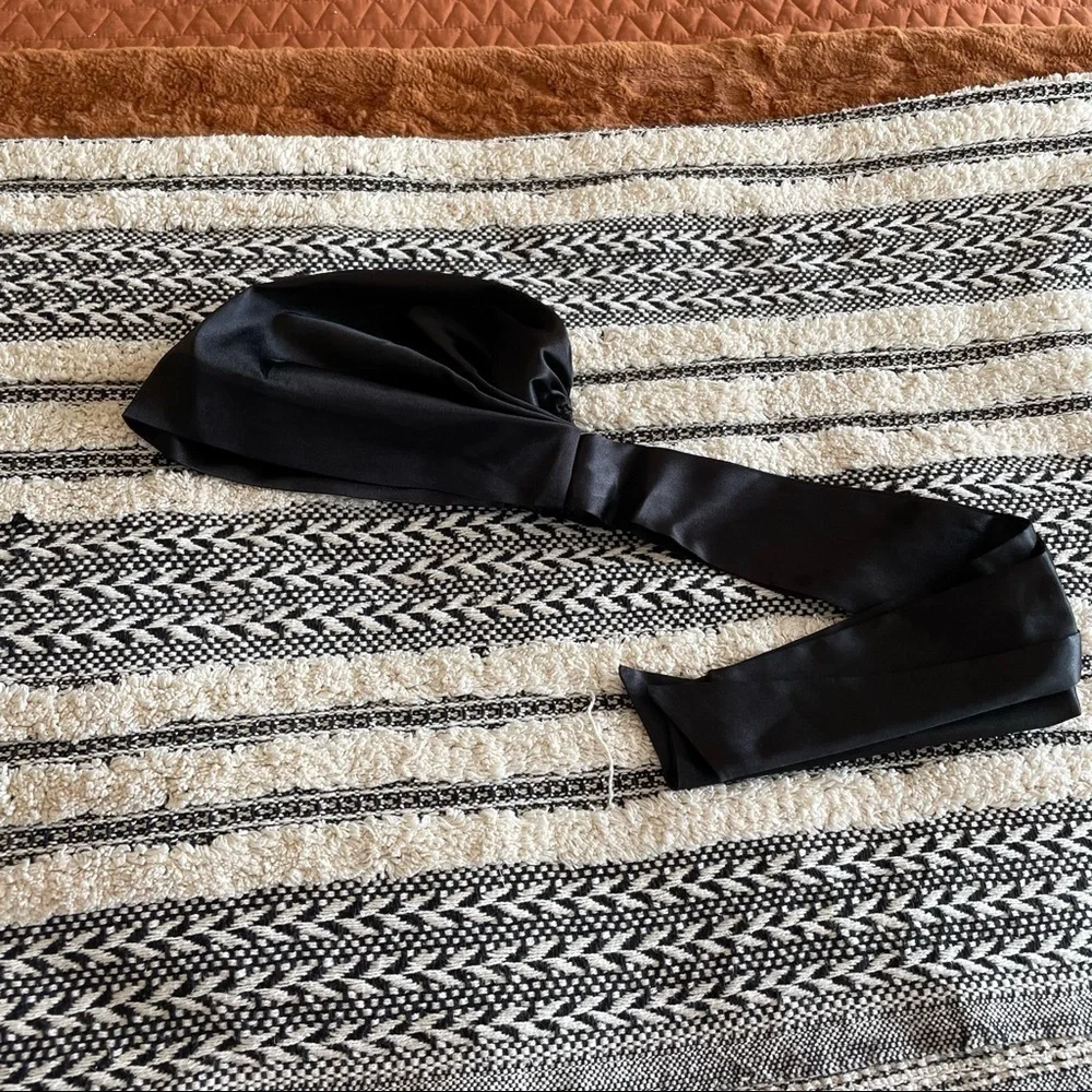 New in package satin black surturban with pony tail hole